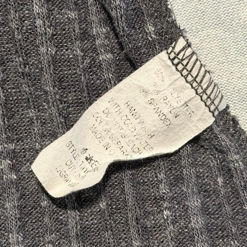 Gray ribbed knit sweater with paisley pattern on sleeves brown striped shoulders